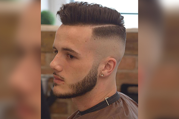Rounded Haircut with A Low Fade and A Hard Part  